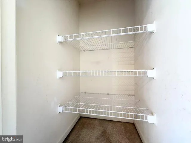 a view of a room with racks on the wall