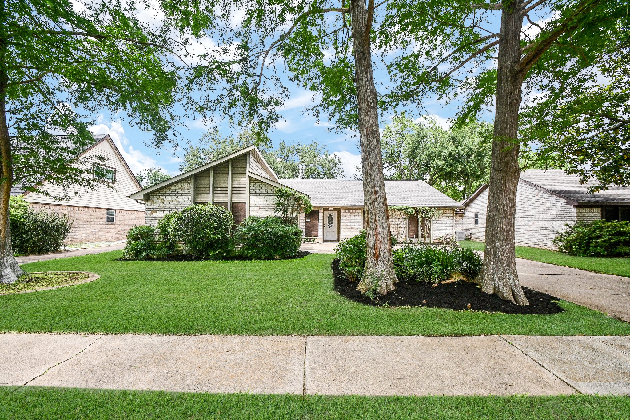What a clean, charming view of the front exterior of this very special home, located at 11635 Sageville Lane, Houston, TX, in the gently wooded, beautifully maintained Sageglen neighborhood.