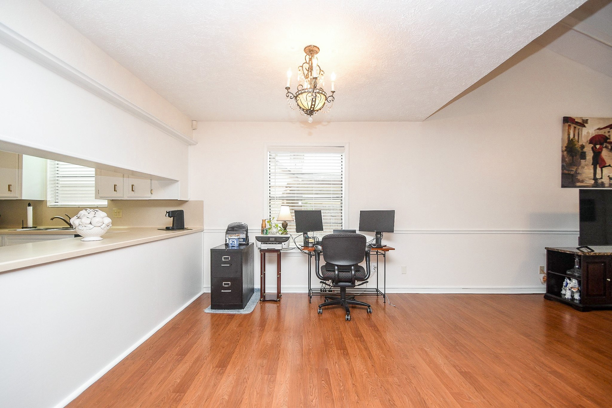 11635 Sagevale Lane Houston, TX 77089 - Photo 13 of 32 Just look at the long counter, left! (Imagine hosting a Sunday brunch with your specialties lined up!) This part of the living/family area can be purposed as your lifestyle fits. An open, makeshift home office looks perfectly comfortable under this nice big window, for example. This space can also be widened as a formal dining space, if desired. It's all up to you!