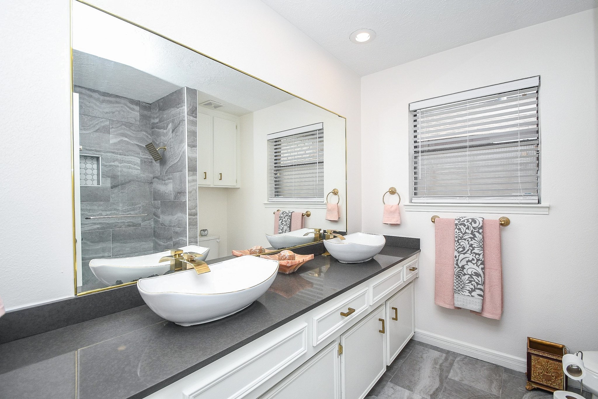11635 Sagevale Lane Houston, TX 77089 - Photo 24 of 32 Lovely above counter dual sinks are works of art in this primary ensuite bath.