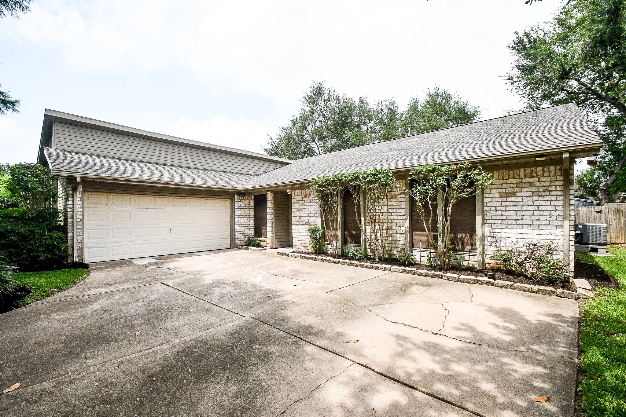 11635 Sagevale Lane Houston, TX 77089 - Photo 3 of 32 The dual-vehicle attached garage shares generous parking space for visitor's cars, too!