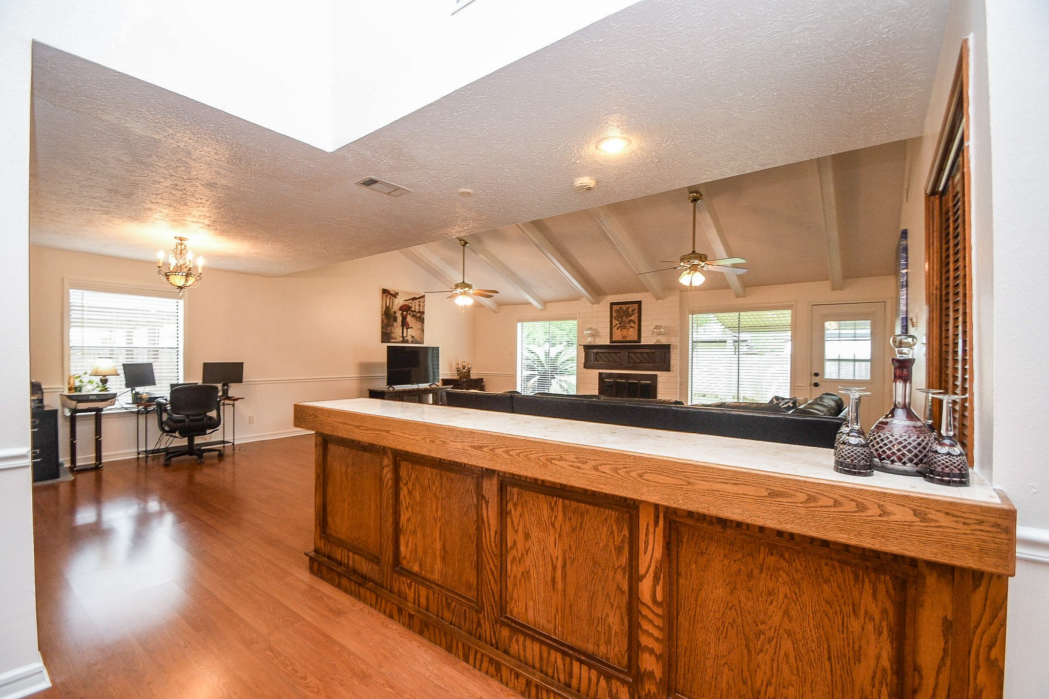 11635 Sagevale Lane Houston, TX 77089 - Photo 8 of 32 Repeated high ceilings grace this casual family/living space, with great natural light and built-in fireplace.
