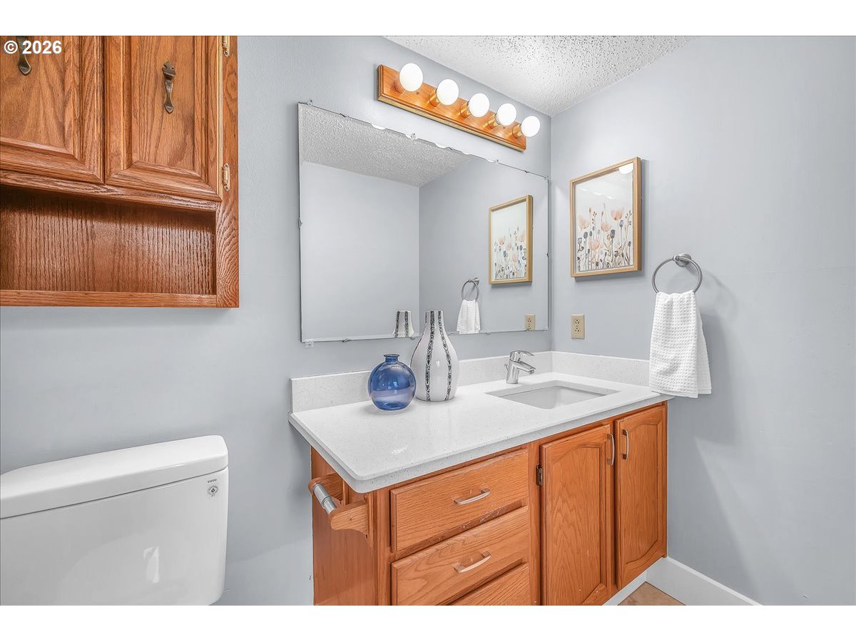 2775 Southwest 182nd Avenue Beaverton, OR 97003 - Photo 14 of 35 a bathroom with a sink a vanity and a toilet