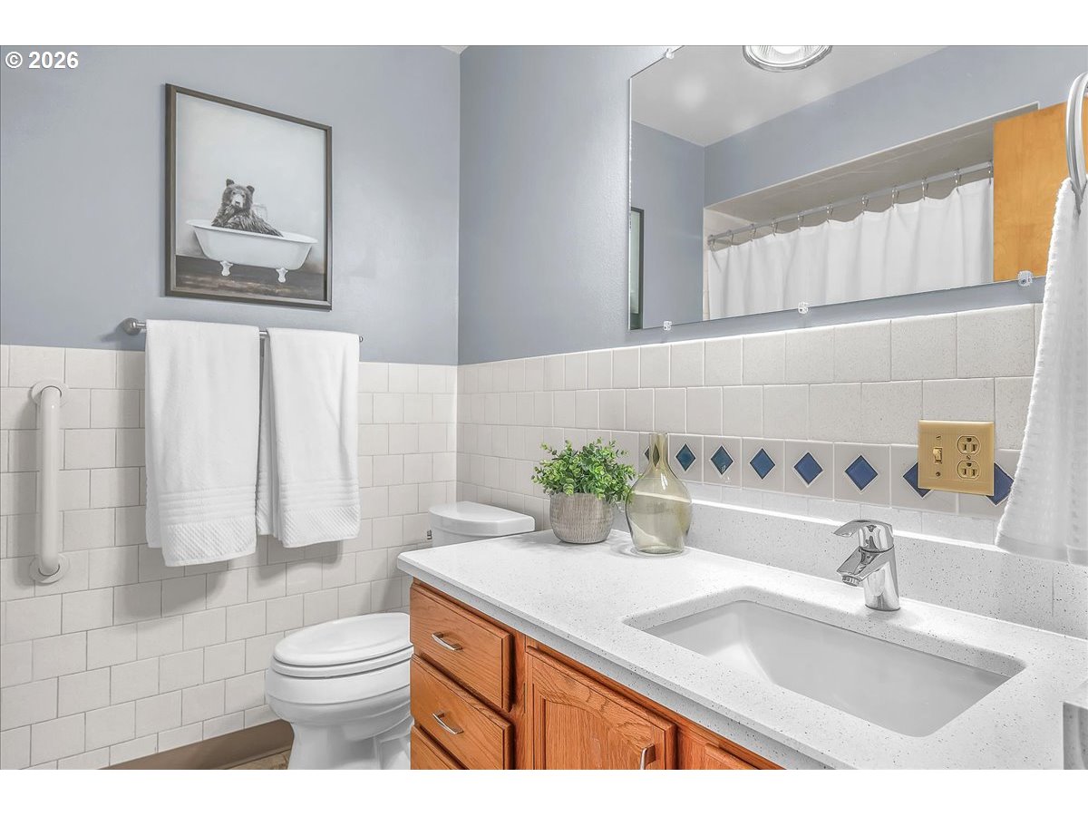2775 Southwest 182nd Avenue Beaverton, OR 97003 - Photo 17 of 35 a bathroom with a granite countertop sink mirror vanity and toilet