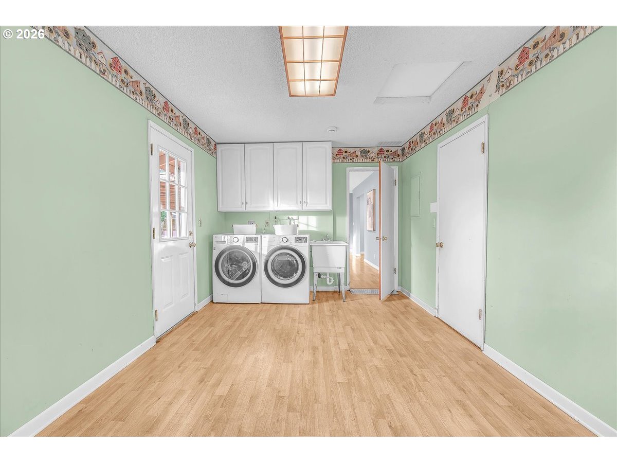2775 Southwest 182nd Avenue Beaverton, OR 97003 - Photo 20 of 35 a view of a hallway with a washer and dryer