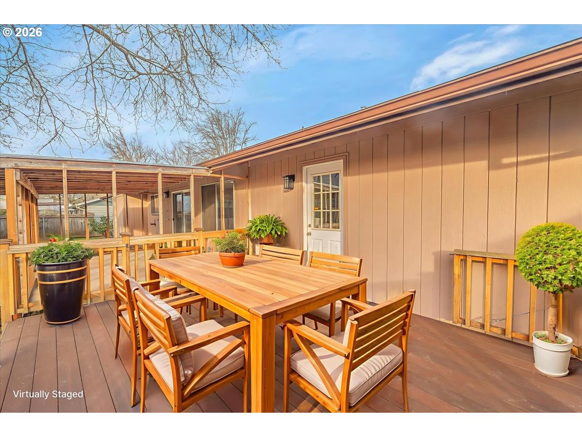 2775 Southwest 182nd Avenue Beaverton, OR 97003 - Photo 24 of 35 a view of a patio with table and chairs potted plants with wooden floor
