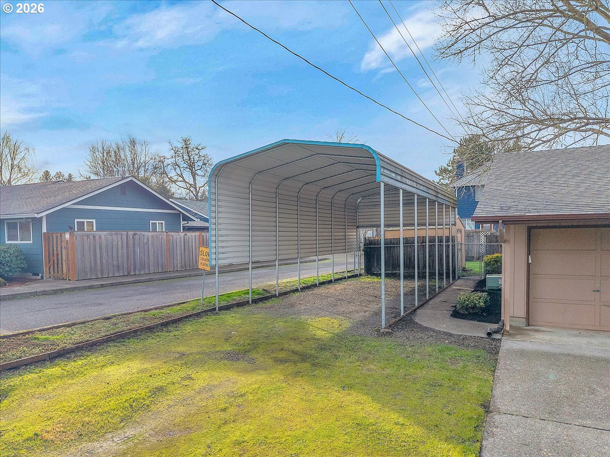 2775 Southwest 182nd Avenue Beaverton, OR 97003 - Photo 30 of 35 a view of a house with a small yard and wooden fence