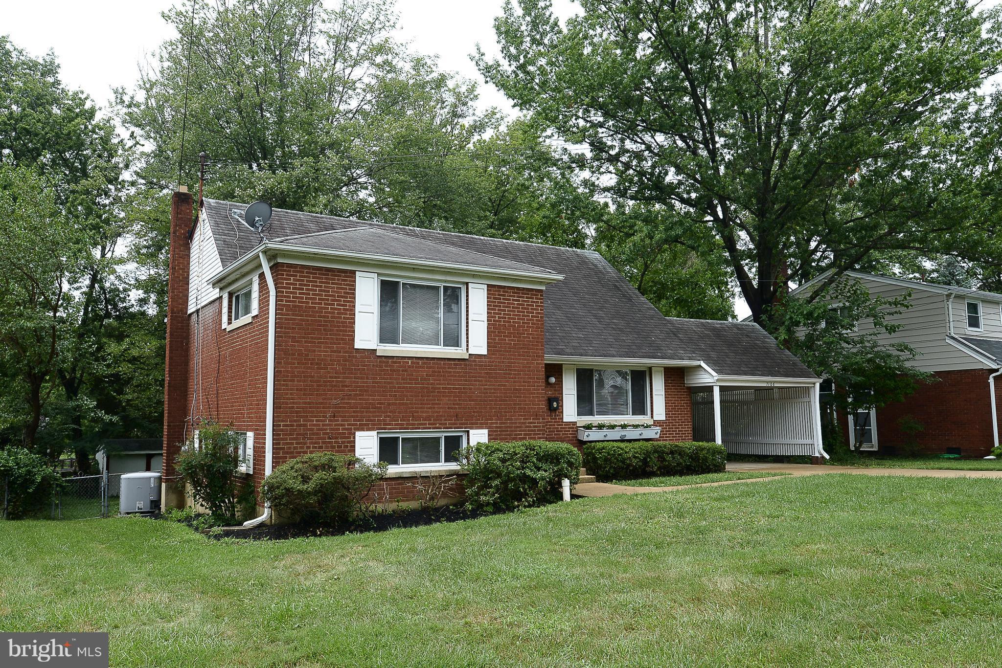 7106 Reservoir Road Springfield, VA 22150 - Photo 1 of 18 a front view of a house with a yard