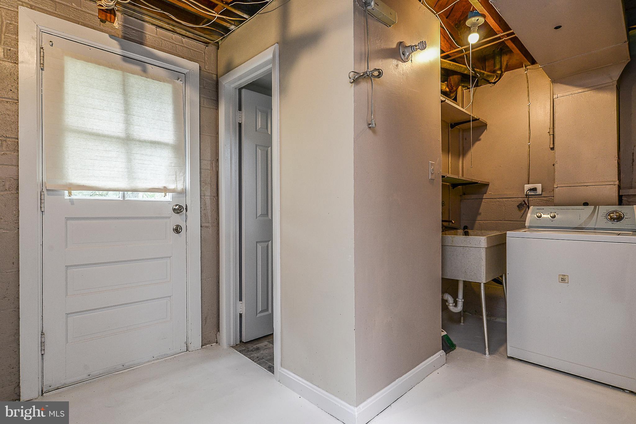 7106 Reservoir Road Springfield, VA 22150 - Photo 18 of 18 a bathroom with a sink and a mirror