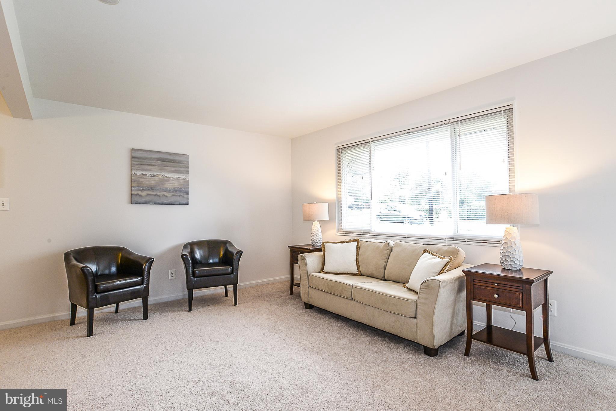 7106 Reservoir Road Springfield, VA 22150 - Photo 4 of 18 a living room with furniture and a large window
