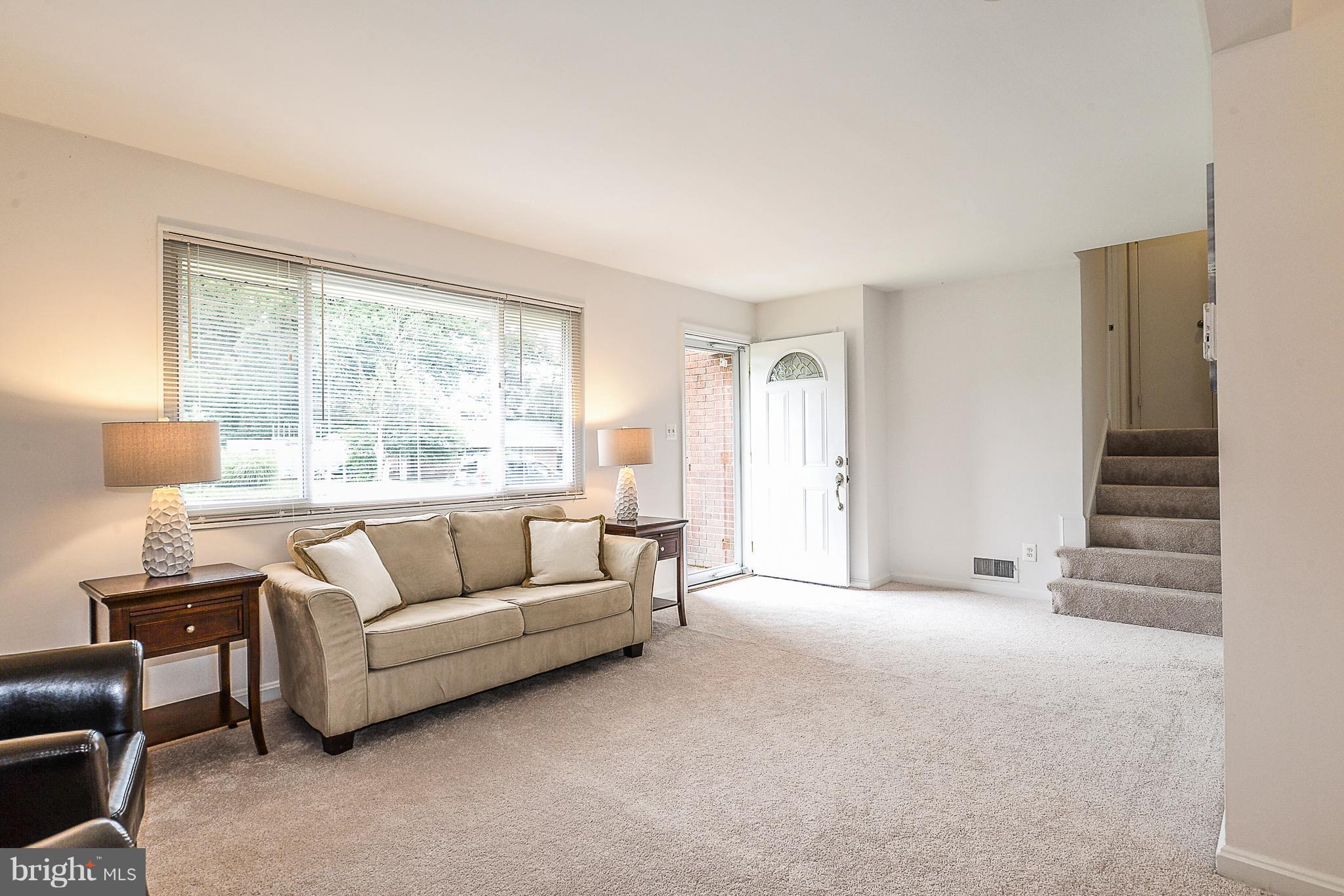 7106 Reservoir Road Springfield, VA 22150 - Photo 5 of 18 a living room with furniture and a large window