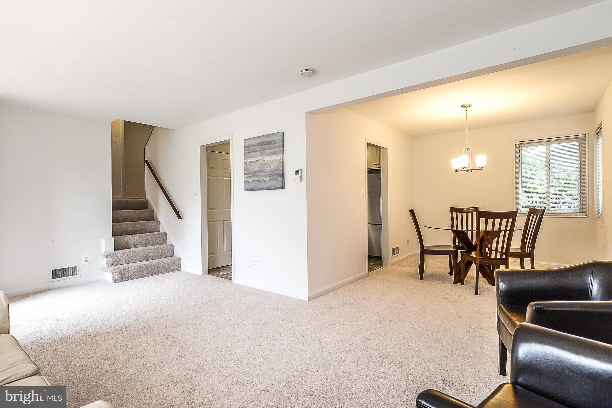 7106 Reservoir Road Springfield, VA 22150 - Photo 6 of 18 a view of a livingroom with furniture and stairs