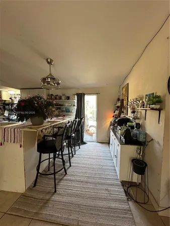 a view of entryway with furniture and wooden floor