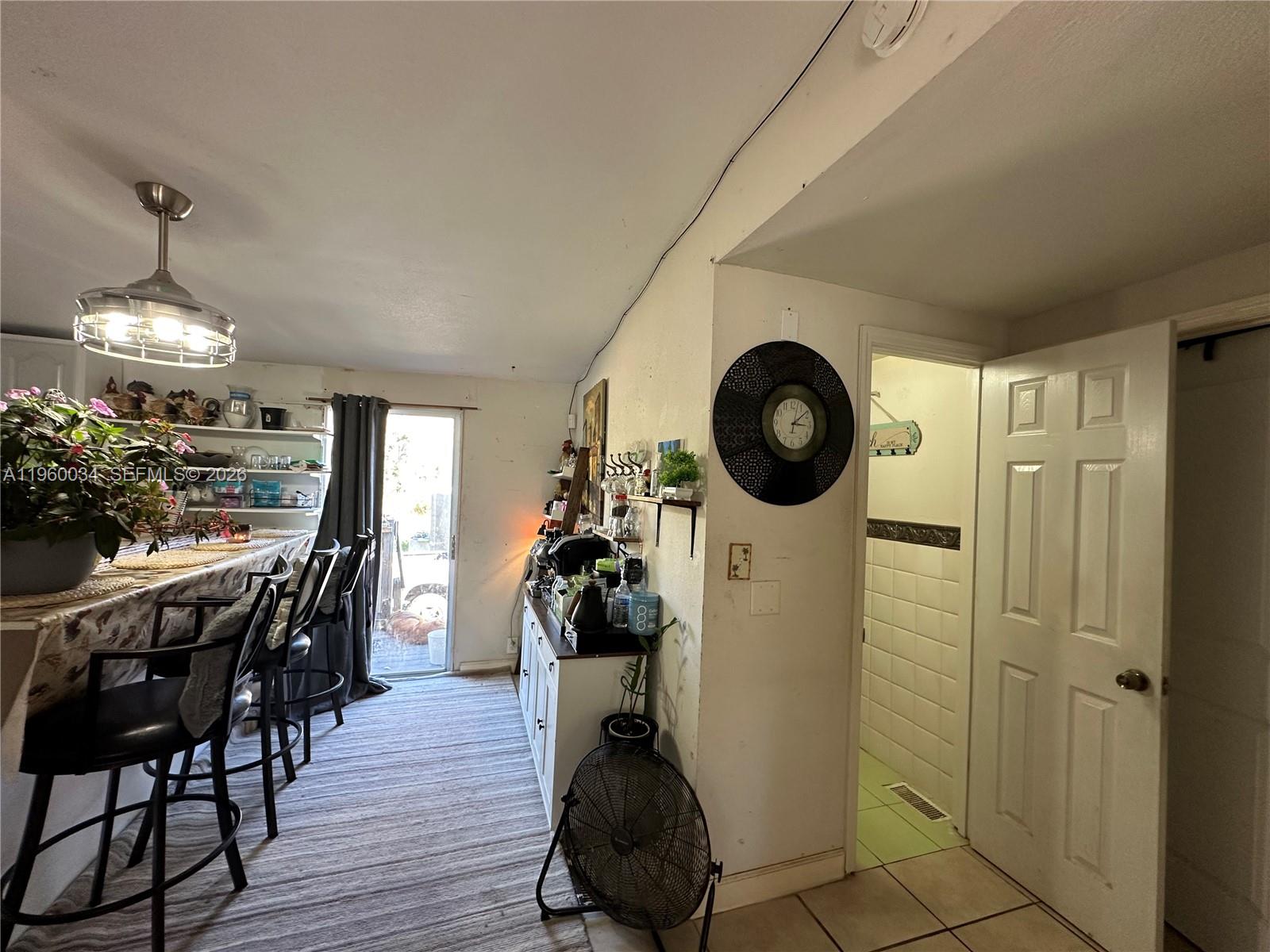 212 Ballard Road Avon Park, FL 33825 - Photo 25 of 61 a view of a dining room with furniture and wooden floor