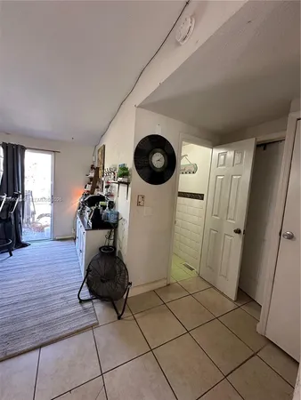 a kitchen with furniture and window