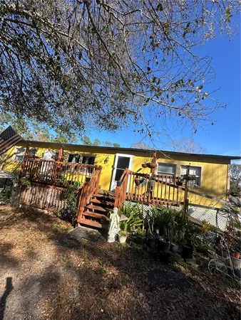 a view of swimming pool with seating area
