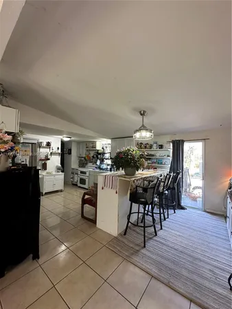 a kitchen with stainless steel appliances a refrigerator and cabinets