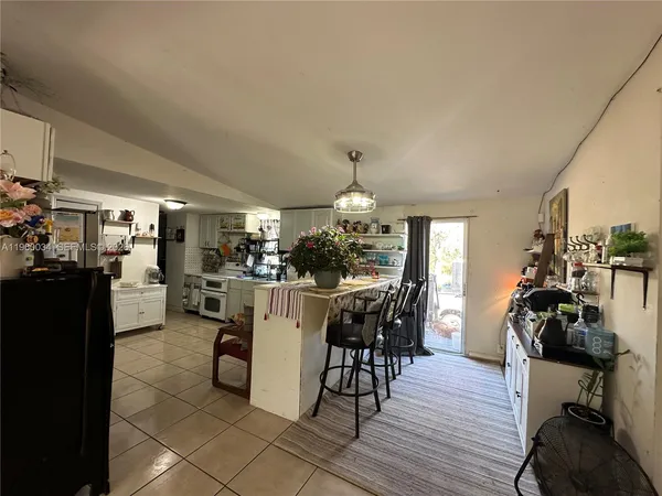 a kitchen with stainless steel appliances a refrigerator and a stove