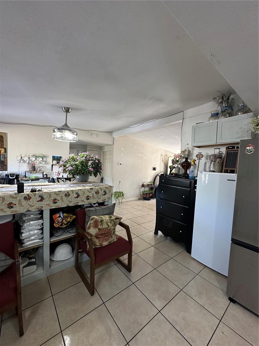 212 Ballard Road Avon Park, FL 33825 - Photo 38 of 61 a kitchen with stainless steel appliances kitchen island granite countertop a refrigerator and a stove