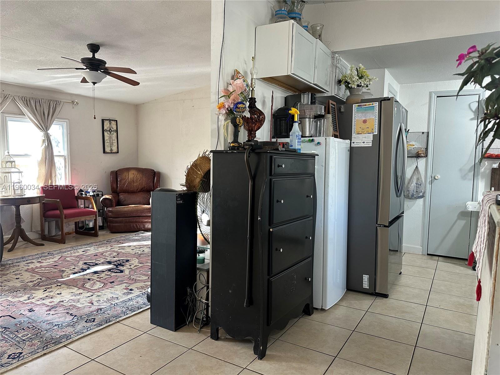 212 Ballard Road Avon Park, FL 33825 - Photo 52 of 61 a living room with furniture and a refrigerator