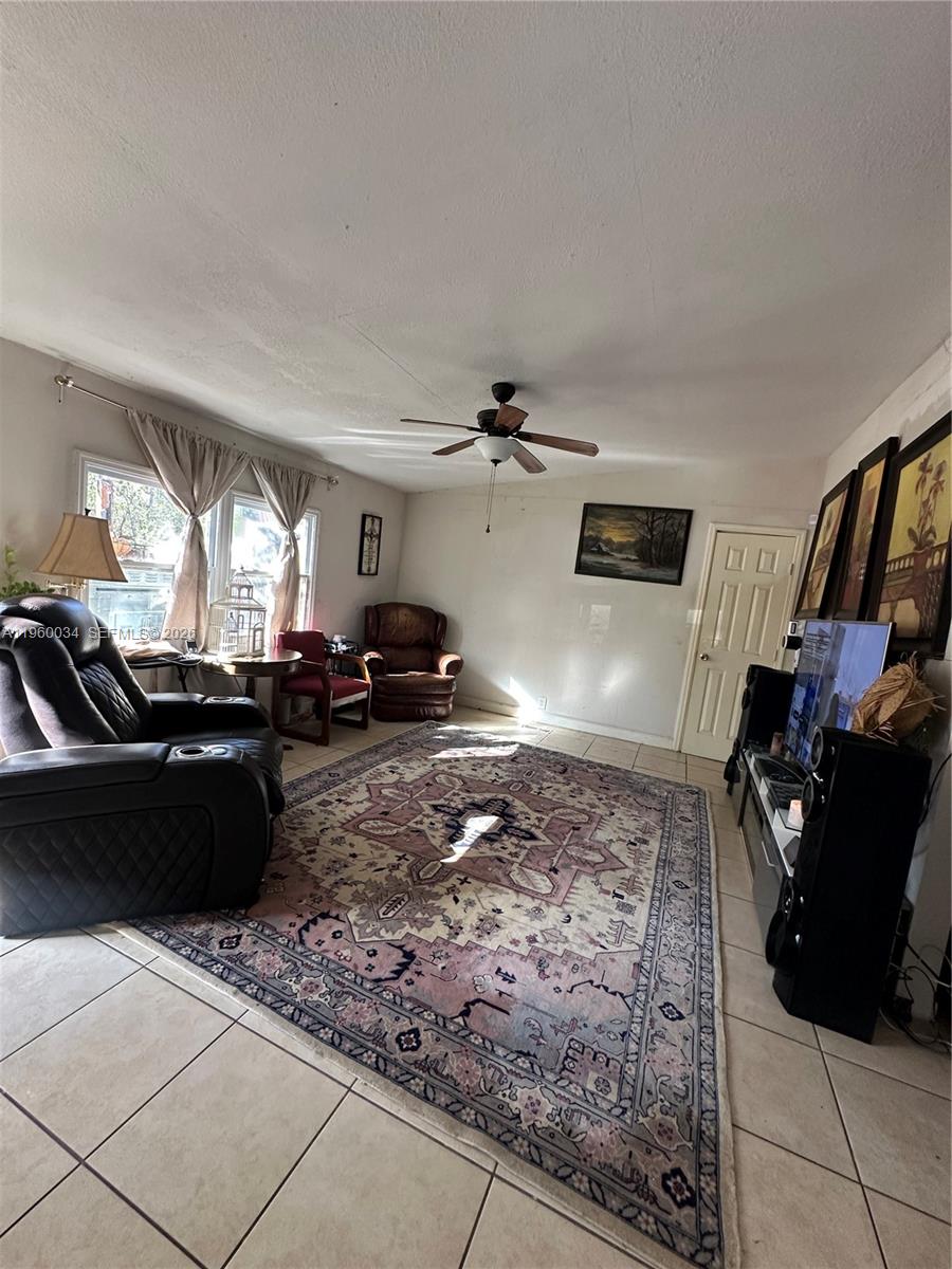 212 Ballard Road Avon Park, FL 33825 - Photo 56 of 61 a living room with furniture and a flat screen tv