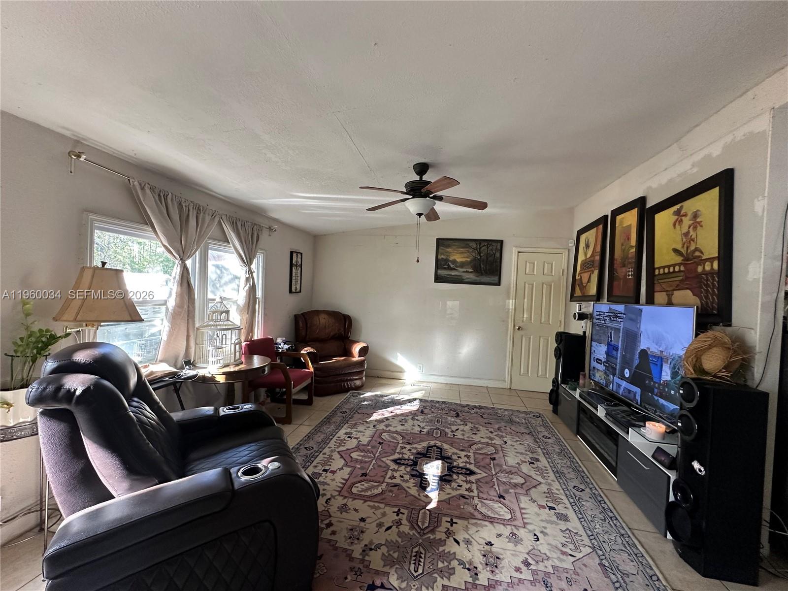 212 Ballard Road Avon Park, FL 33825 - Photo 57 of 61 a living room with furniture chess board and a fireplace