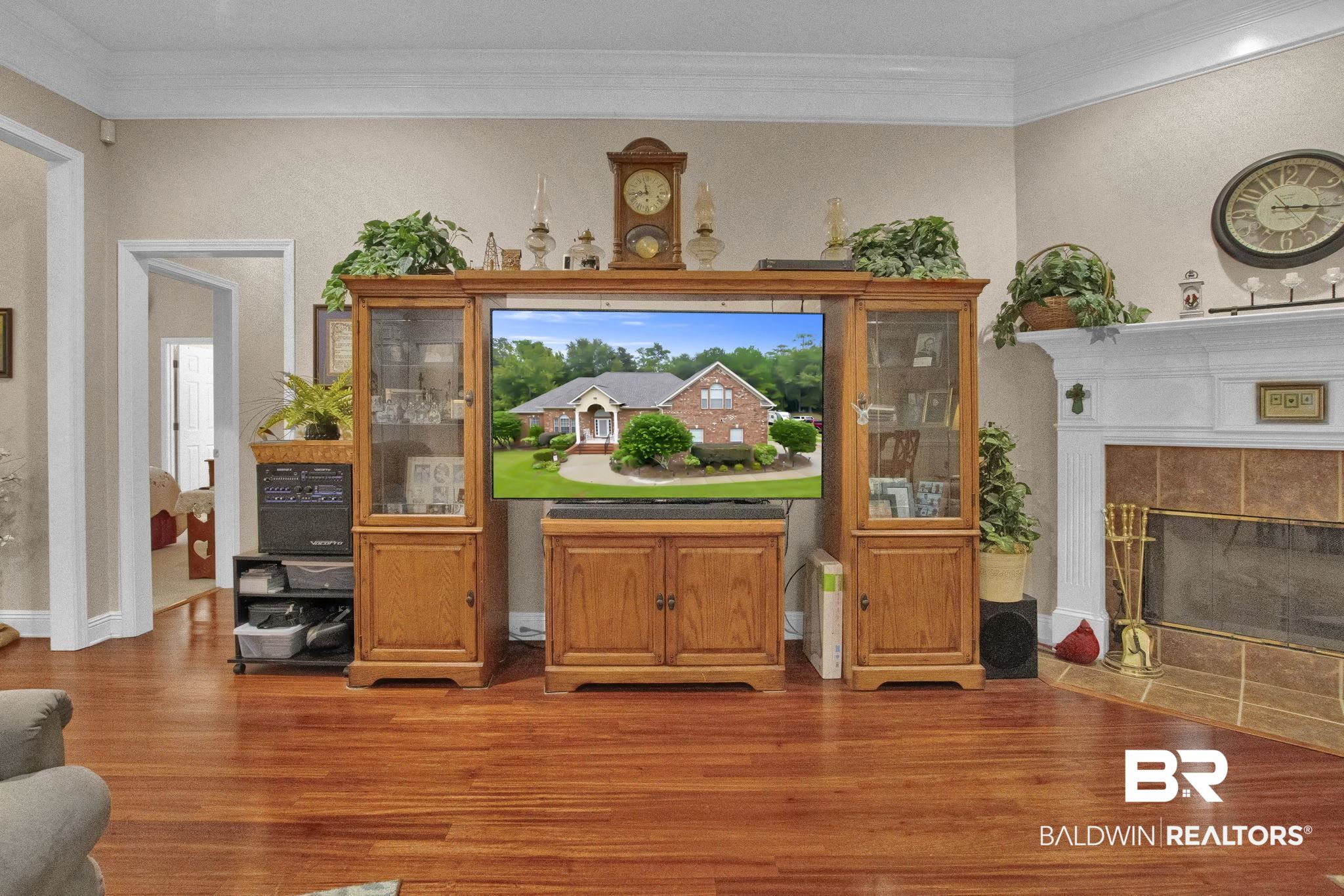 1 Bens Bluff Daphne, AL 36527 - Photo 11 of 56 Living room featuring hardwood / wood-style floors, a fireplace, and ornamental molding