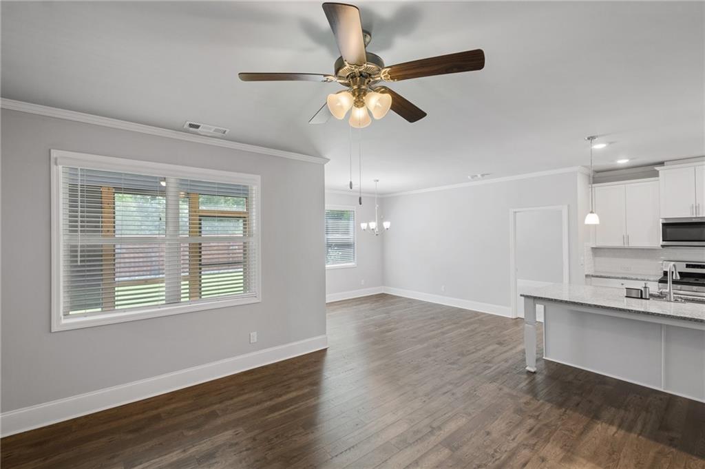75 South Cornucopia Bend Dallas, GA 30132 - Photo 16 of 35 a view of an empty room with a window and wooden floor