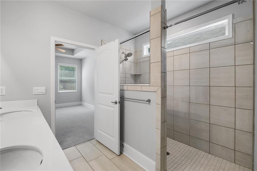 75 South Cornucopia Bend Dallas, GA 30132 - Photo 21 of 35 a bathroom with a shower and mirror