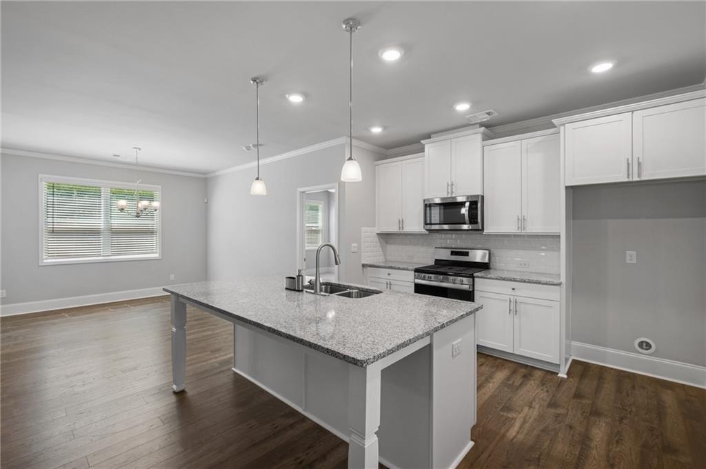 75 South Cornucopia Bend Dallas, GA 30132 - Photo 9 of 35 a kitchen with a sink stove and refrigerator