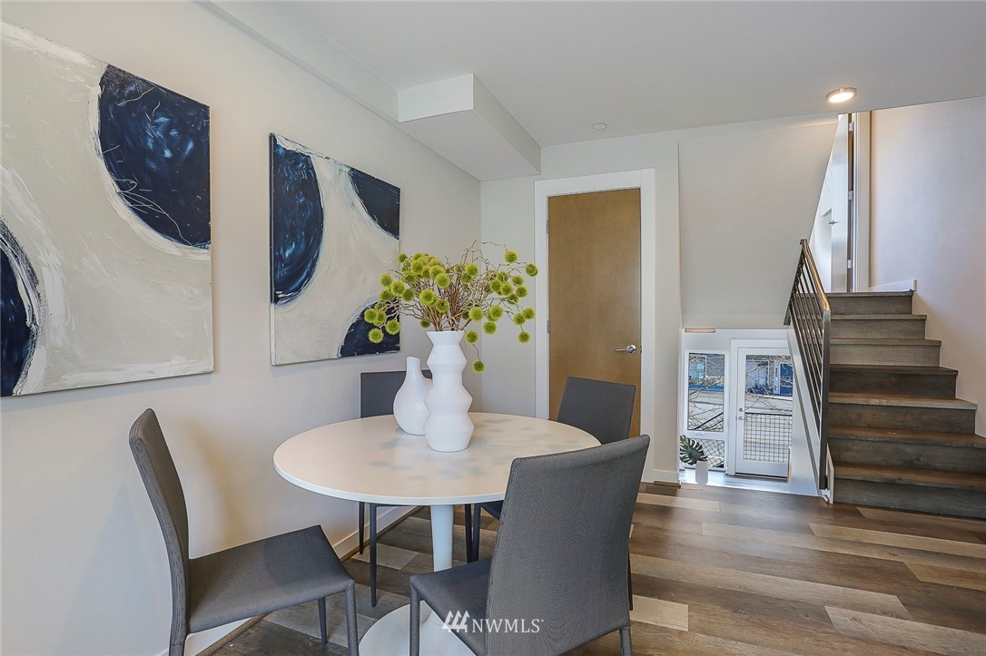 6241 8th Avenue Northwest Seattle, WA 98107 - Photo 13 of 27 a view of a dining room with furniture and wooden floor