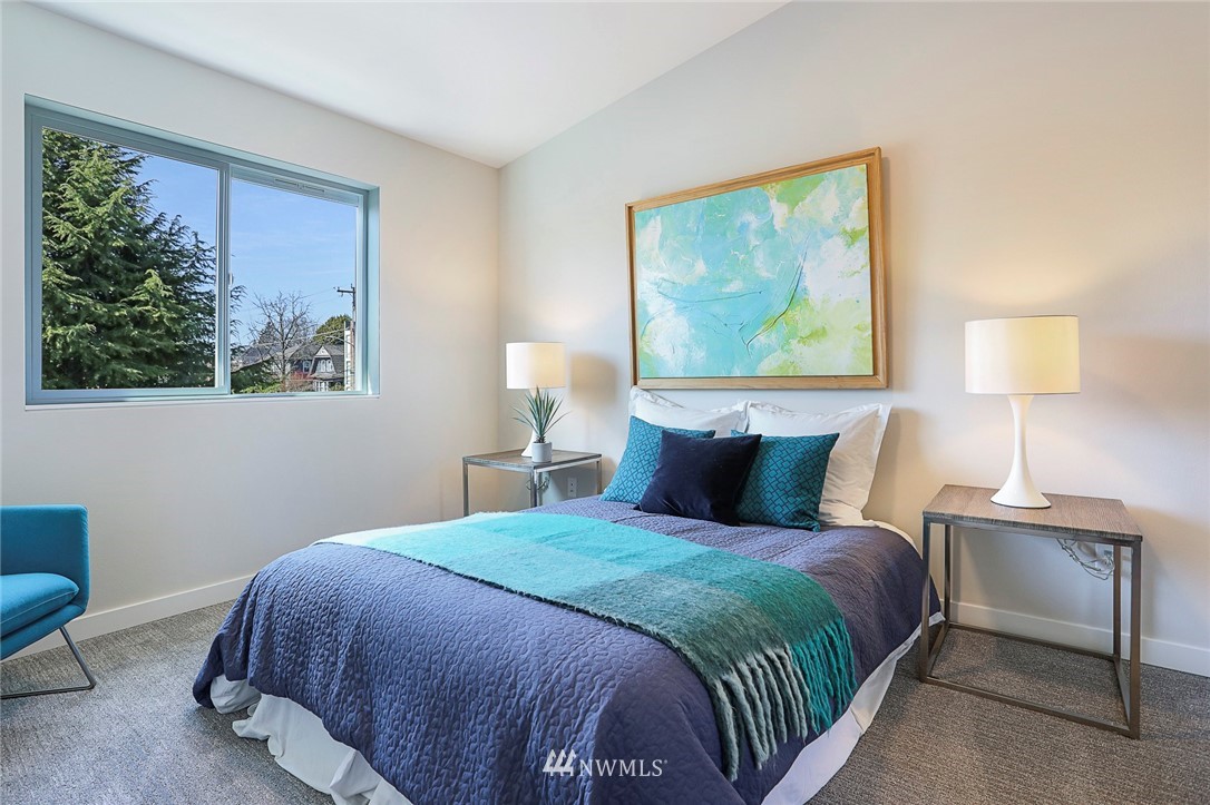 6241 8th Avenue Northwest Seattle, WA 98107 - Photo 17 of 27 a bedroom with a bed and a painting on the wall