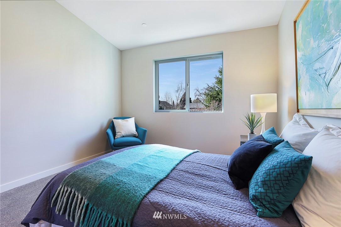 6241 8th Avenue Northwest Seattle, WA 98107 - Photo 18 of 27 a bedroom with a bed and a window