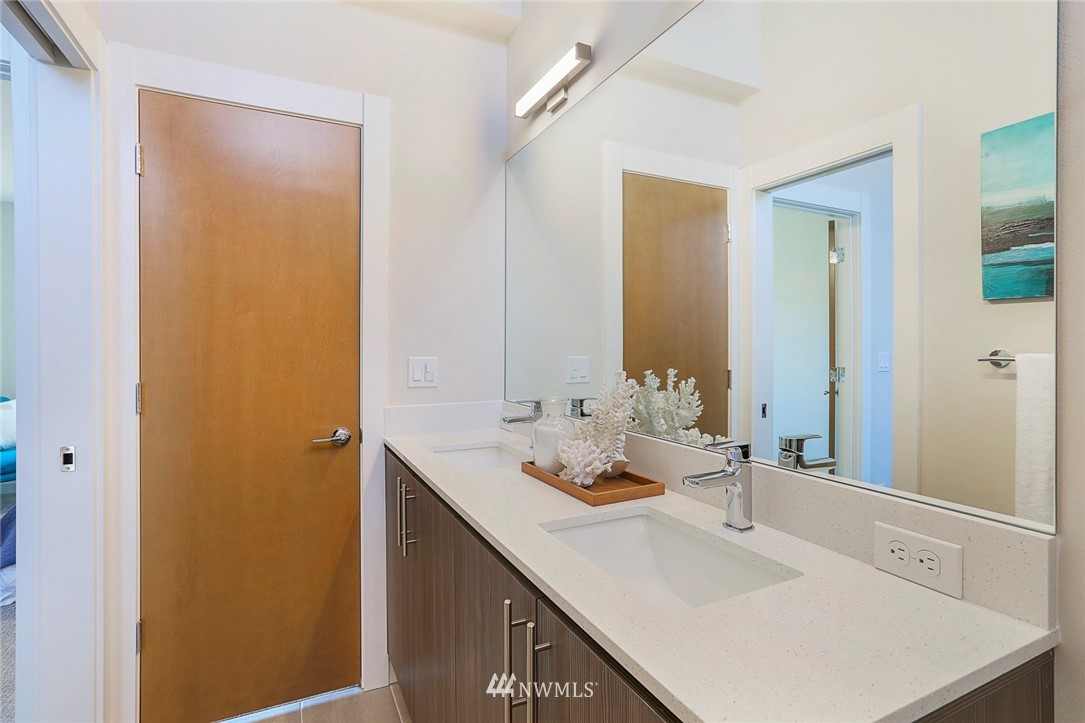 6241 8th Avenue Northwest Seattle, WA 98107 - Photo 21 of 27 a bathroom with a sink and a mirror
