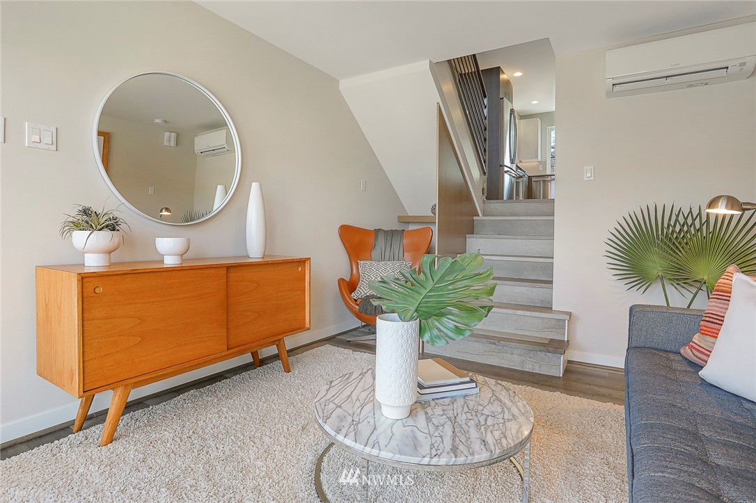 6241 8th Avenue Northwest Seattle, WA 98107 - Photo 4 of 27 a living room with furniture and a mirror