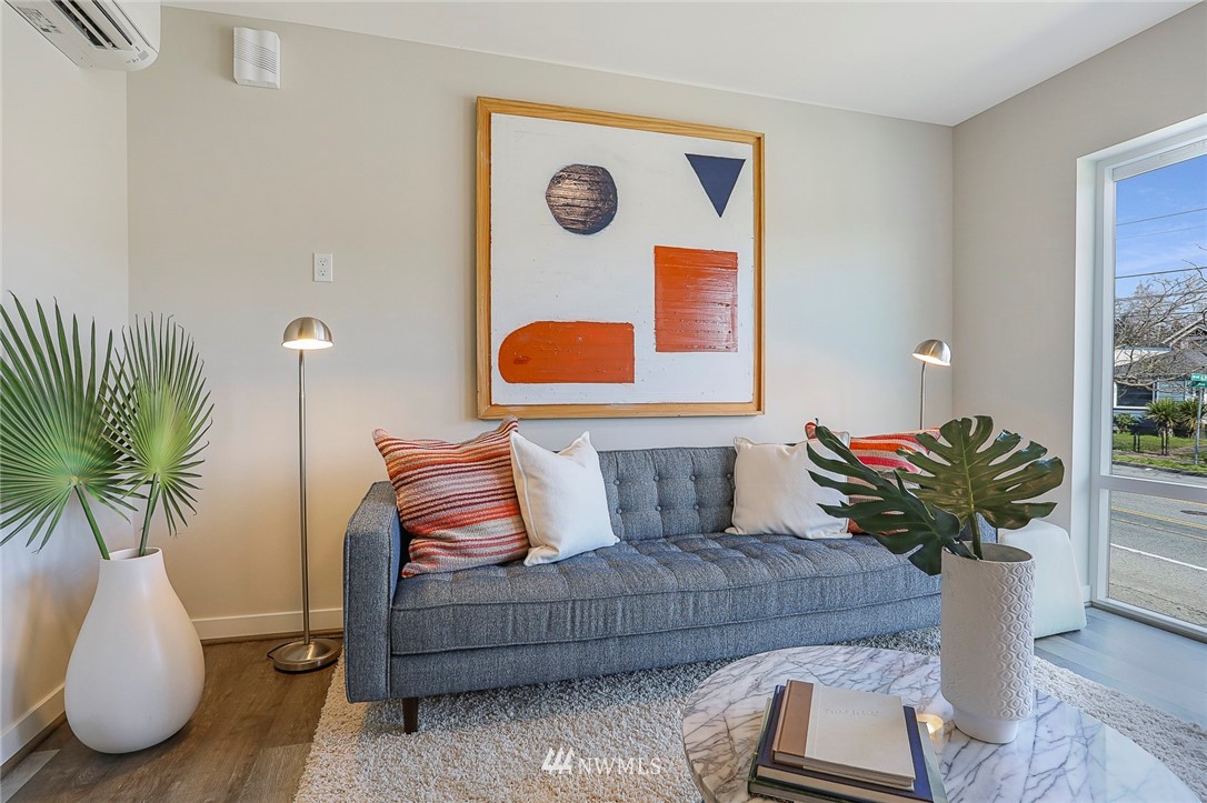 6241 8th Avenue Northwest Seattle, WA 98107 - Photo 7 of 27 a living room with furniture and a potted plant
