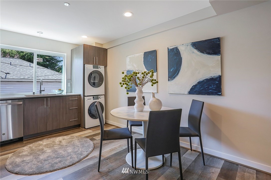 6241 8th Avenue Northwest Seattle, WA 98107 - Photo 9 of 27 a view of a dining room with furniture and wooden floor