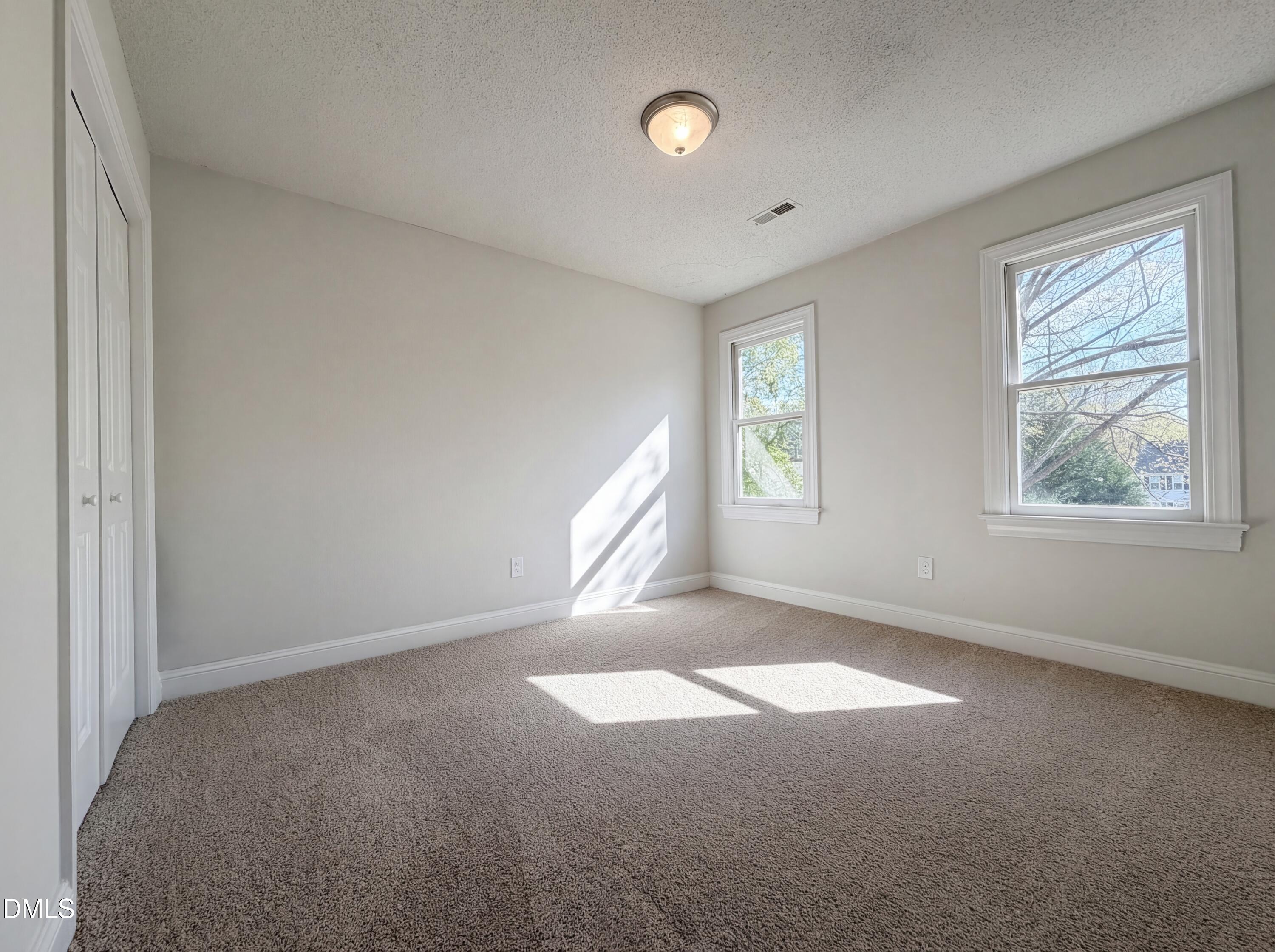 8612 Clovehitch Court Raleigh, NC 27615 - Photo 14 of 25 a view of an empty room with a window