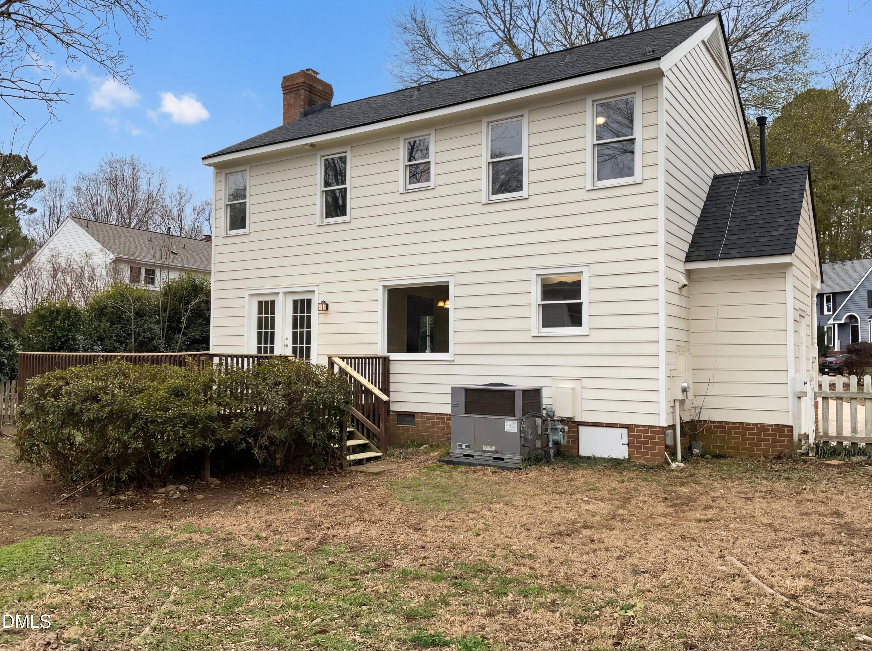8612 Clovehitch Court Raleigh, NC 27615 - Photo 20 of 21 a view of a house with a yard
