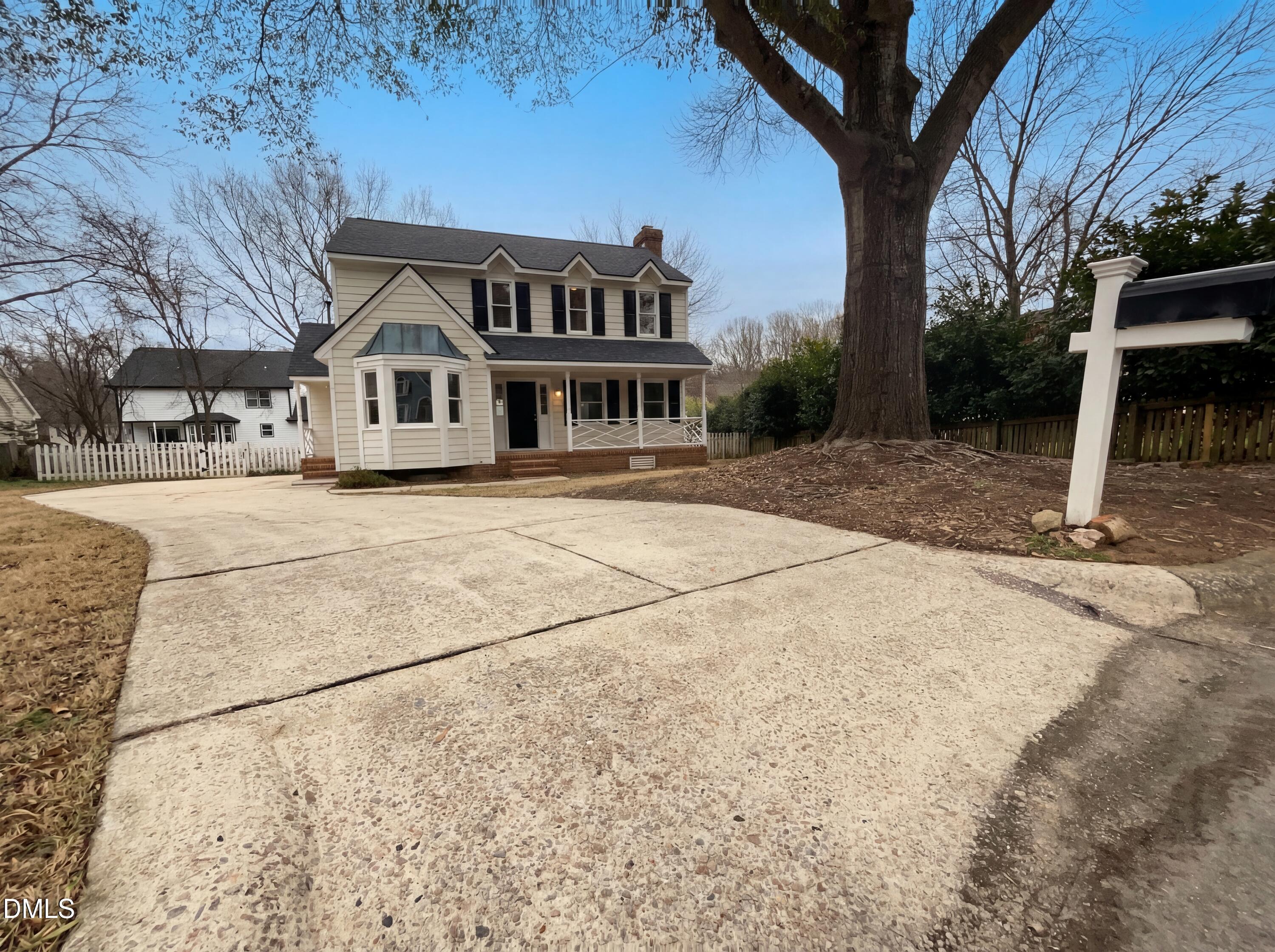 8612 Clovehitch Court Raleigh, NC 27615 - Photo 2 of 21 a front view of a house with a yard