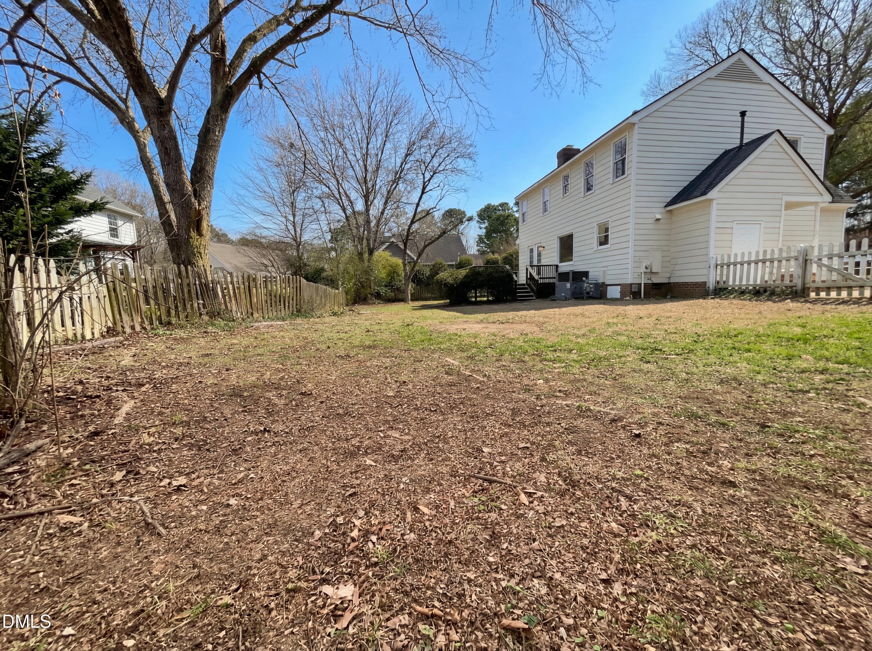 8612 Clovehitch Court Raleigh, NC 27615 - Photo 21 of 21 a view of a house with a yard