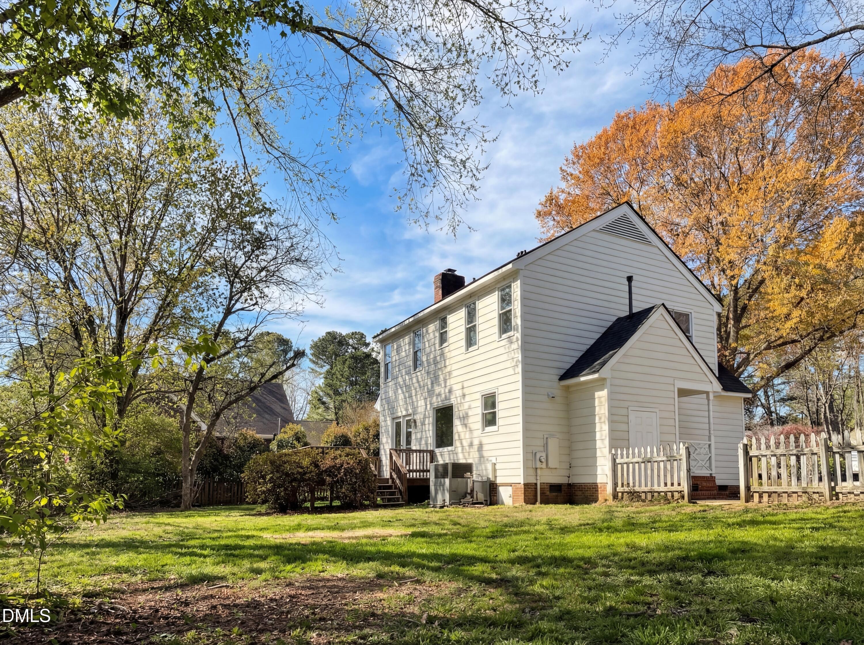8612 Clovehitch Court Raleigh, NC 27615 - Photo 24 of 25 a front view of a house with a yard