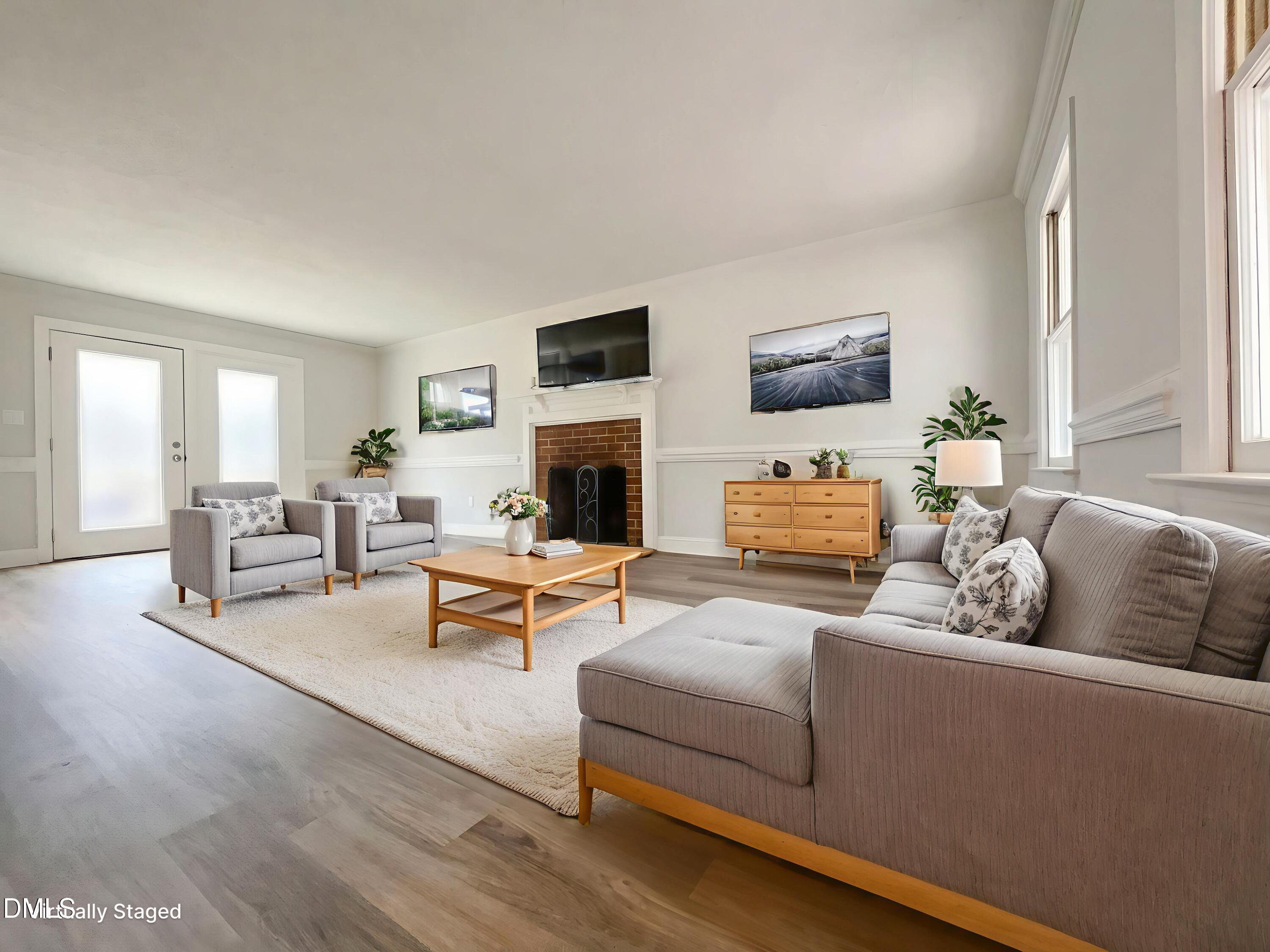 8612 Clovehitch Court Raleigh, NC 27615 - Photo 3 of 21 a living room with furniture and a fireplace