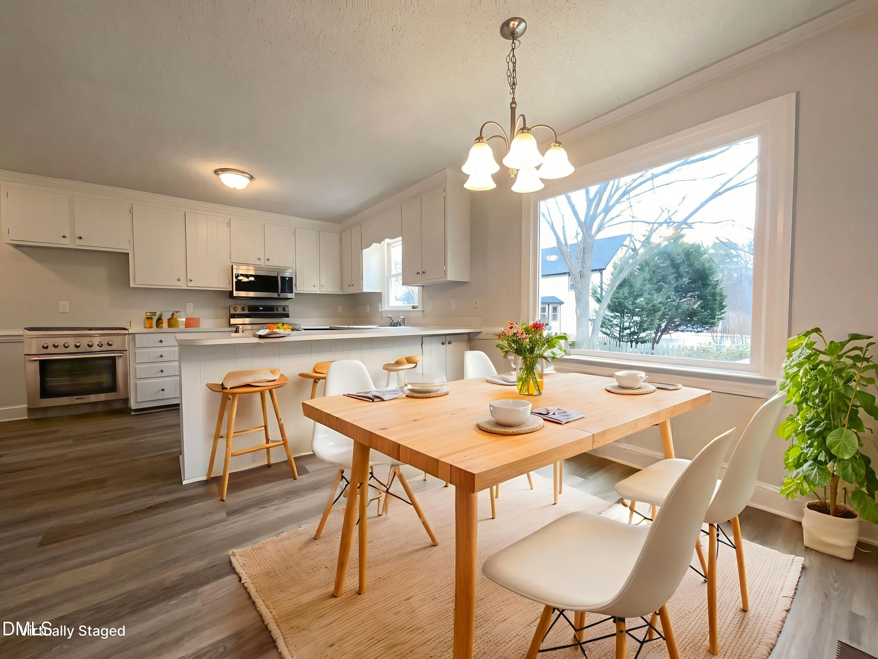 8612 Clovehitch Court Raleigh, NC 27615 - Photo 6 of 21 a view of a dining room with furniture window and wooden floor