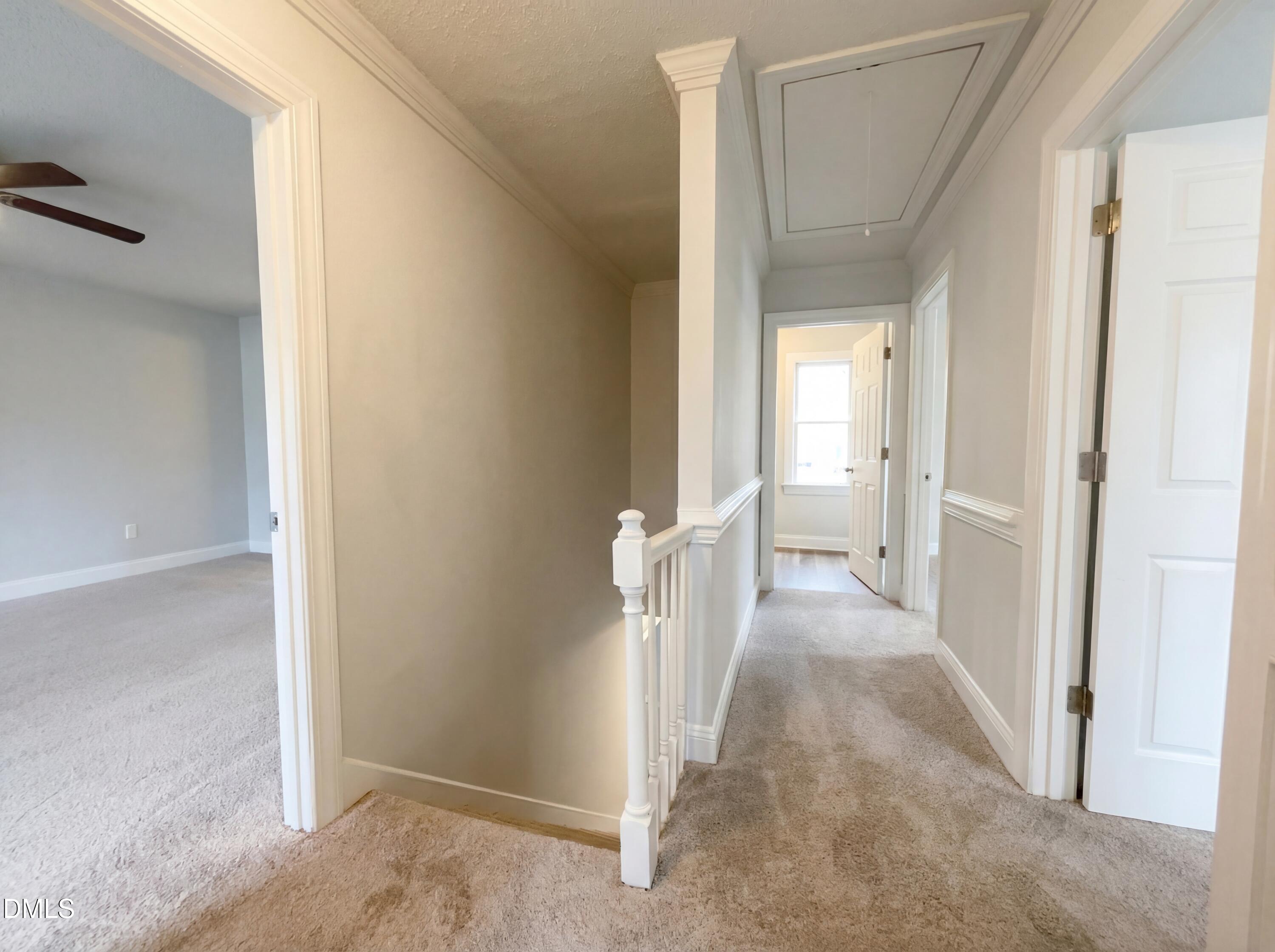 8612 Clovehitch Court Raleigh, NC 27615 - Photo 10 of 21 a view of a bedroom from a hallway