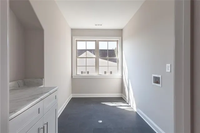 a bathroom with a toilet a sink and a mirror