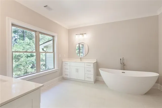 a white bath tub sitting in a bathroom