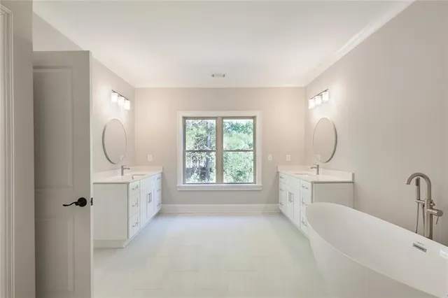 a bathroom with a sink a light fixture and a mirror
