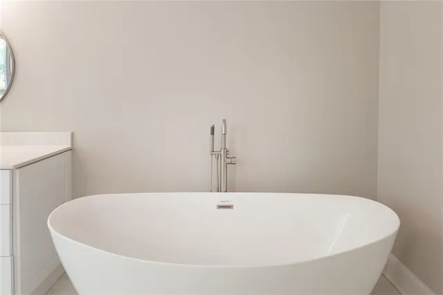 a bathroom with a glass shower door