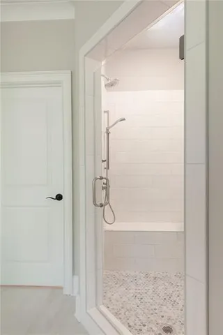 a view of backyard with a large window and wooden floor